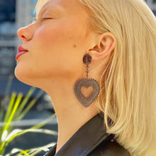 Model Wearing Filienna 14K Gold Heart Statement Earrings in Black Rhodium
