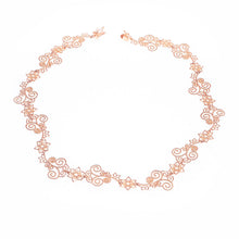 Flower Lady Necklace with flower and swirl details in rose-gold toned blush silver
